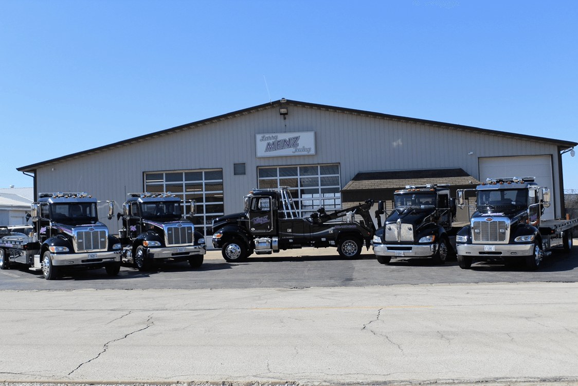 Larry Menz black fleet in front of the shop at 1575 Commerce Dr, Bourbonnais